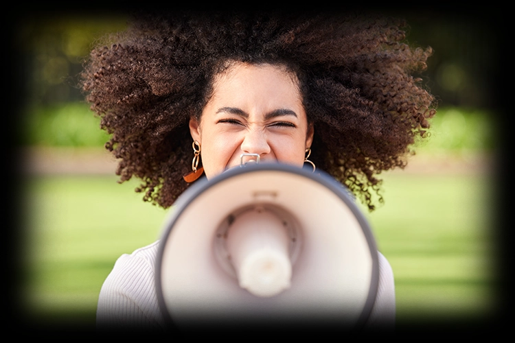 Woman shouting into a megaphone
